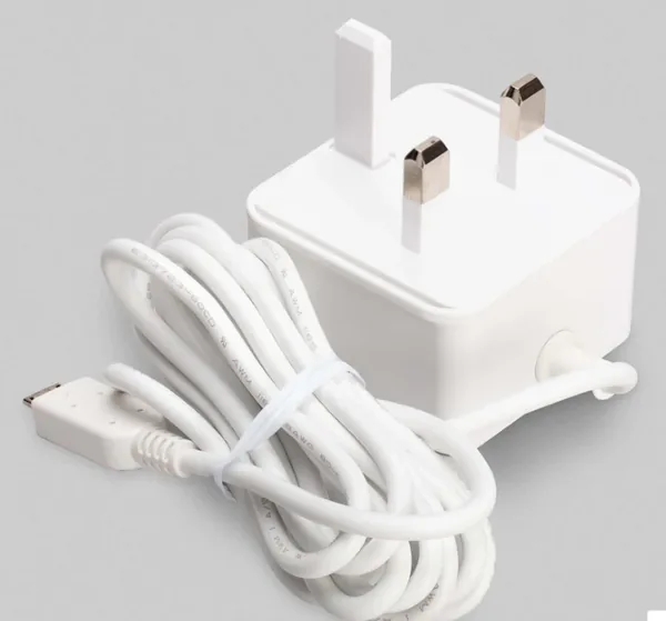 The white UK-plug power supply with its coiled USB-C cable.